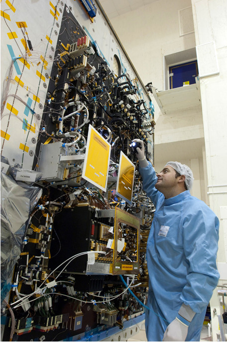 An Airbus engineer inspecting a new spacecraft that incorporates the CAN Bus for Space. Photo credit: Airbus DS