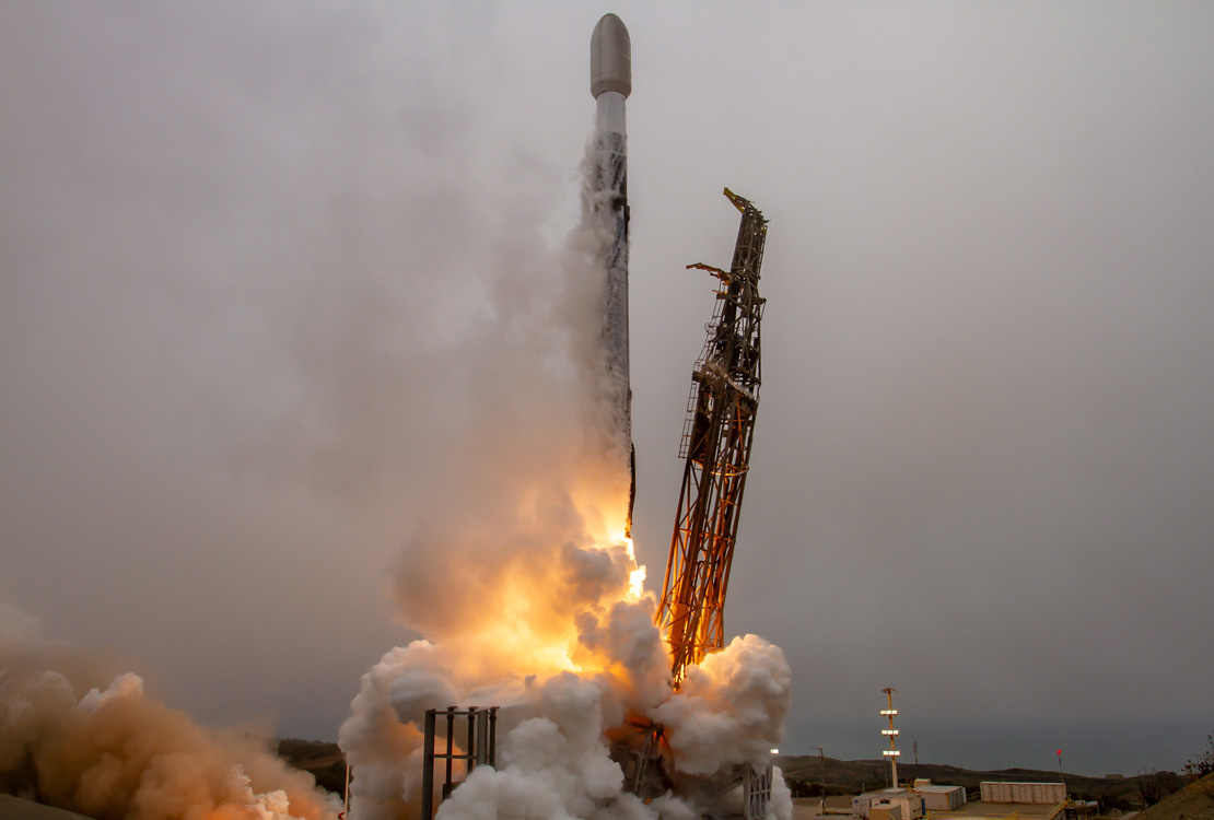 Falcon 9 rocket launching from its launchpad
