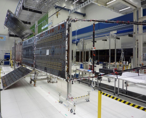 Hybrid Solar Array during deployment testing: the in-line backbone is made up of a conventional solar array, while the lateral panels are lightweight semi-rigid panels (Credit Airbus).
