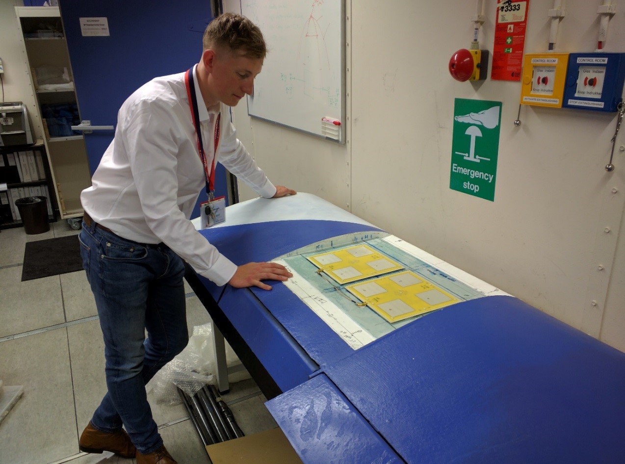 Jack, a BML employee, with the embedded satcoms. Image credit: BML